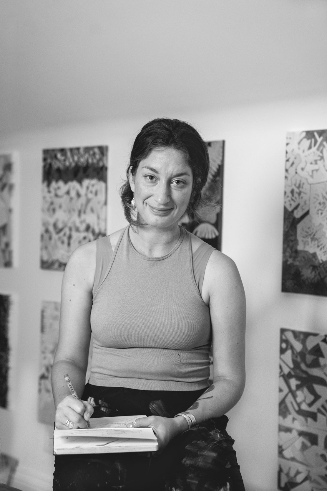 A female painter sitting and writing in her studio in New Orleans