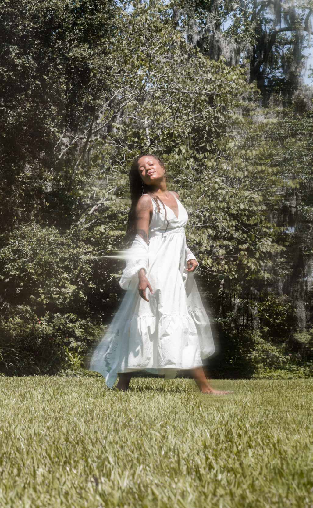 Woman dancing in New Orleans City Park Botanical Garden